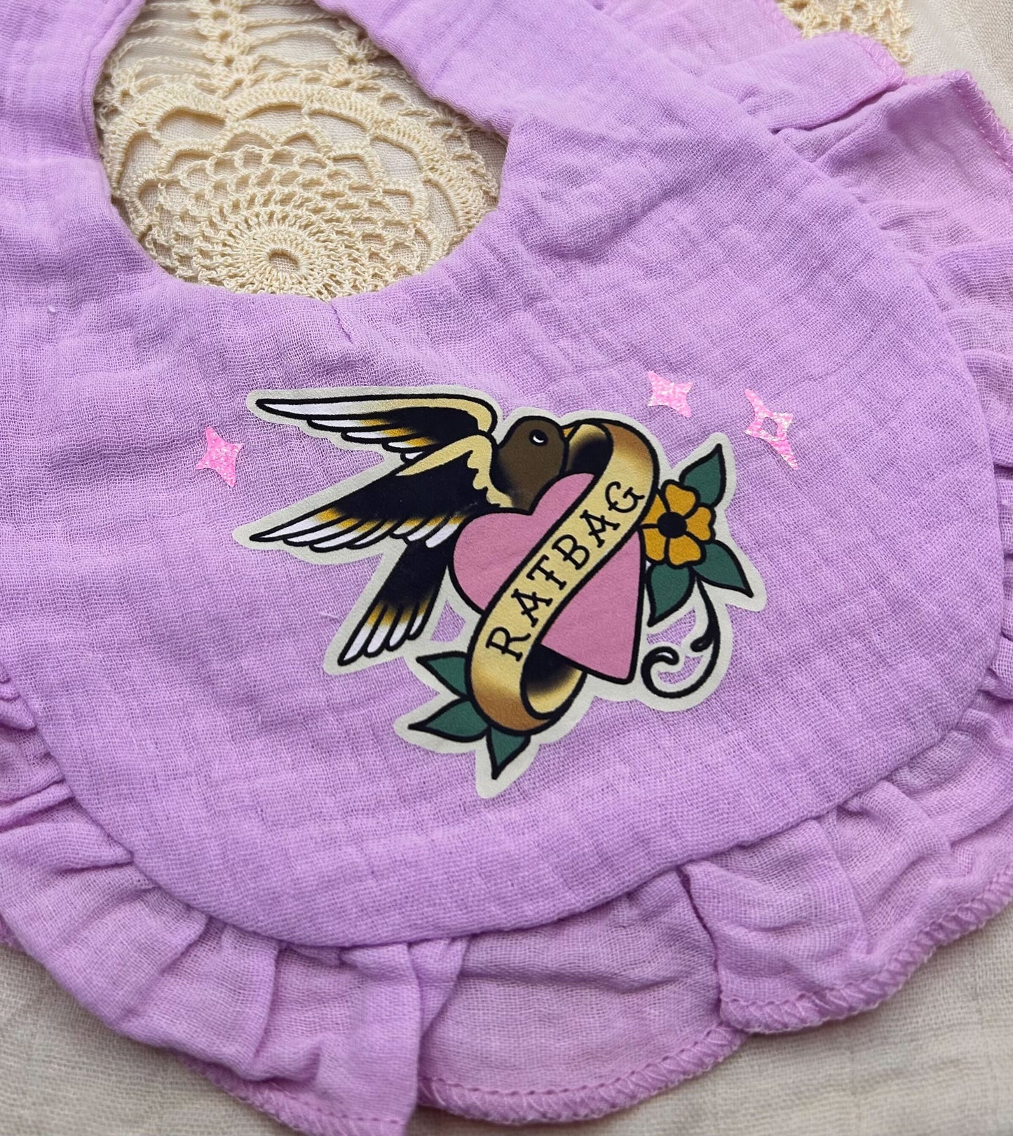 Muslin Frill Bib - Purple 'Ratbag' with Glitter Details